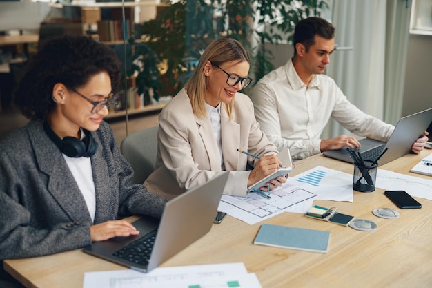 business team is analysing new financial project while working together office desk 673498 3269